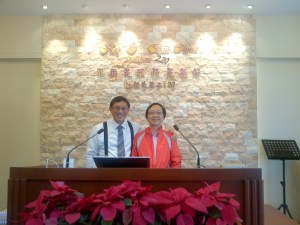 Day 6 attendance to Gateway Bible Baptist Church.  Picture taken with Pastor Peter Shek (Stone), in front of our stone wall, behind our stone baptistry; in our church in Shek Mun (Stone Wall).