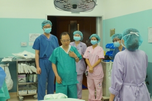 In operation theatre with whole team including Drs Pang & Lam, nurses and assistants.